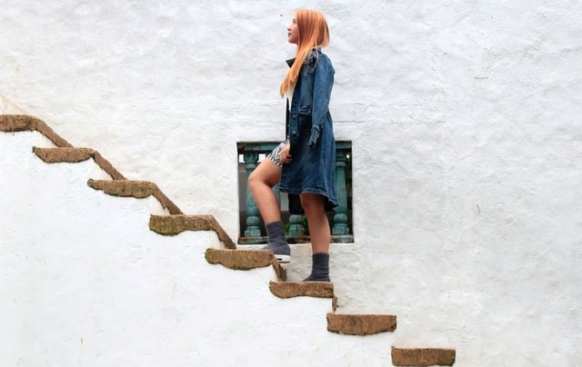 Woman climbing a staircase
